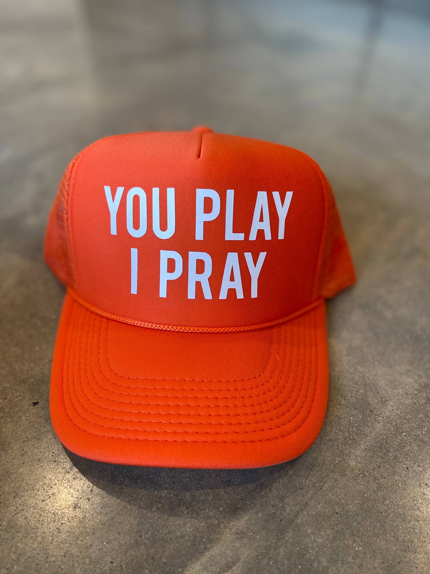 You Play, I Pray Trucker Hat